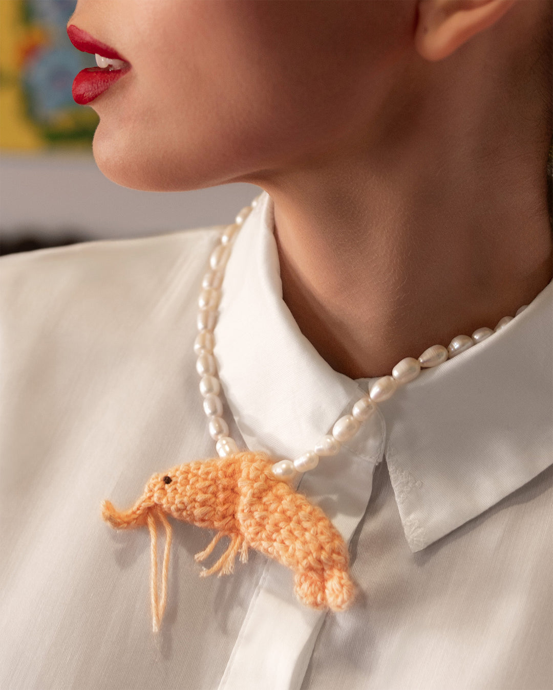 freshwater pearls and crochet shrimp necklace on model