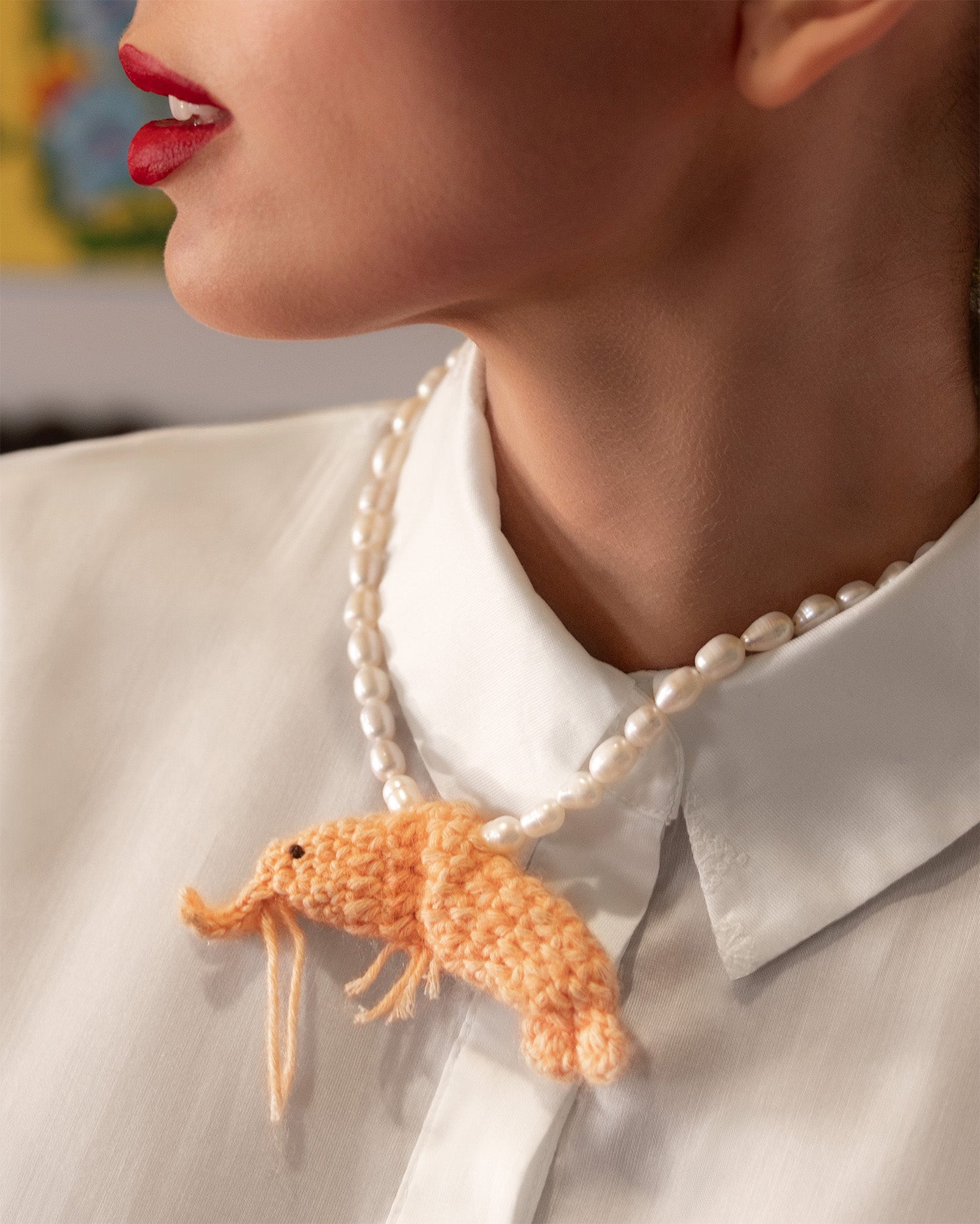 freshwater pearls and crochet shrimp necklace on model