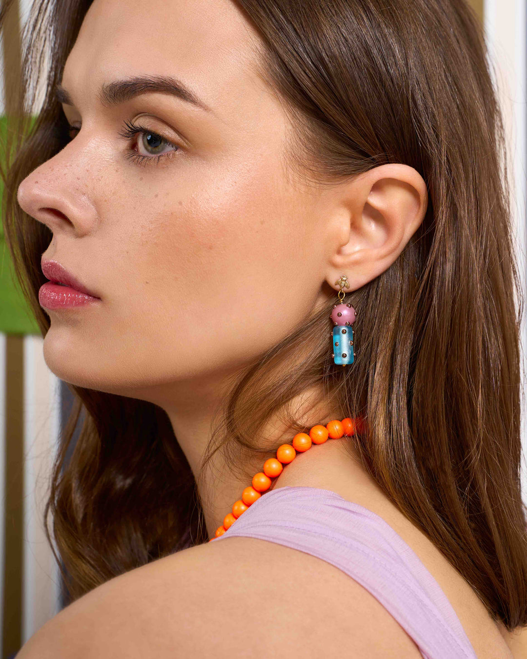 barrel beads on bee cast earrings on model