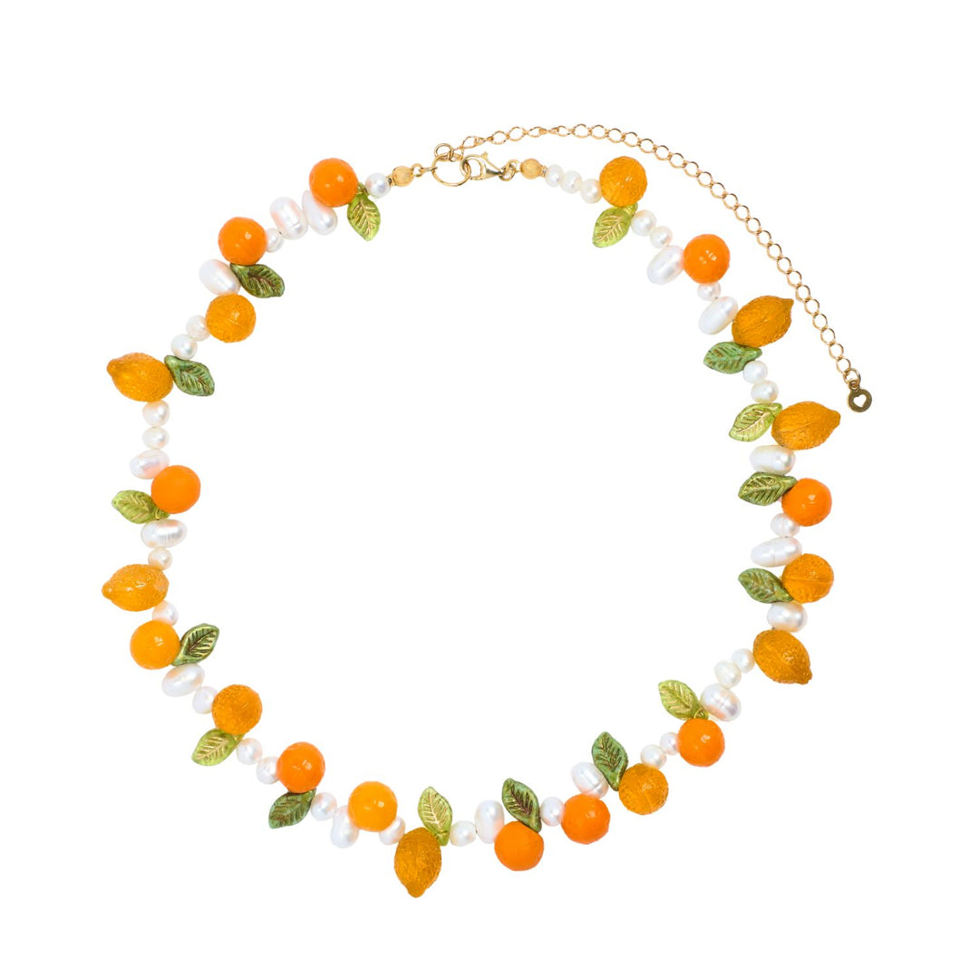 Necklace with orange and green bead design on a white background