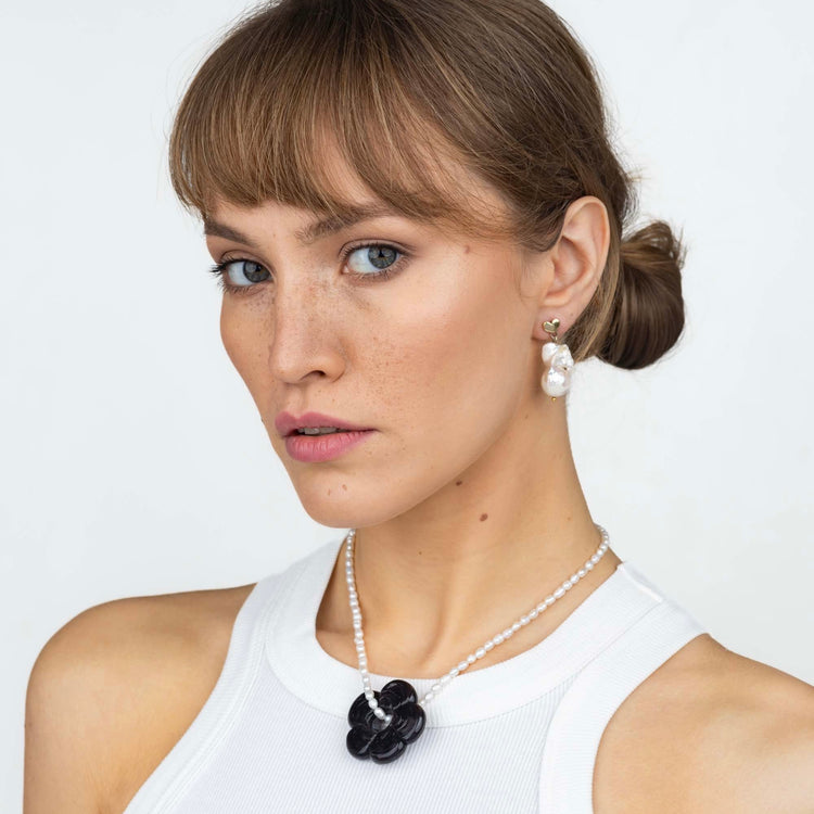 pearl necklace with black ceramic flower