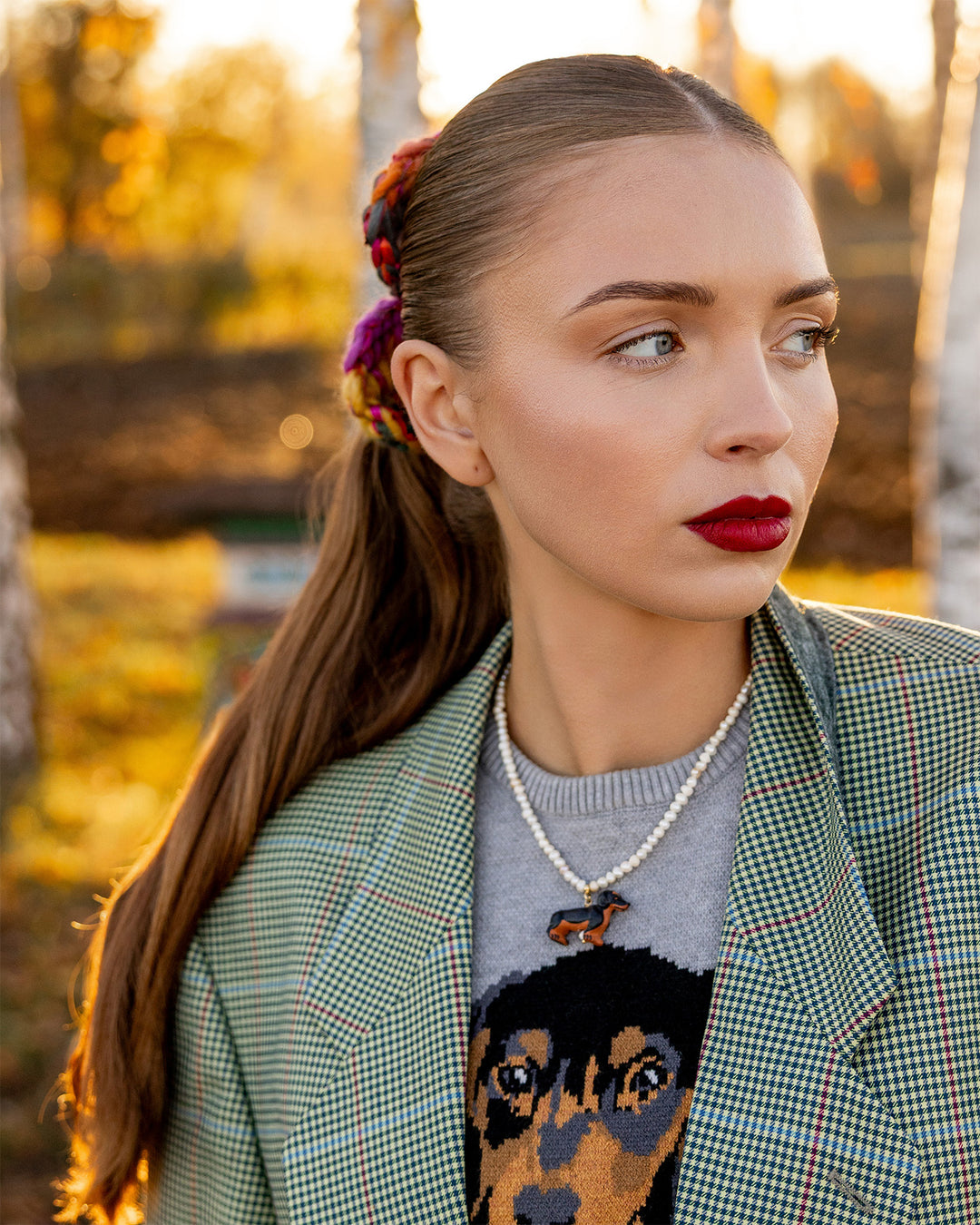 pearls and sausage dog ceramic charm on model