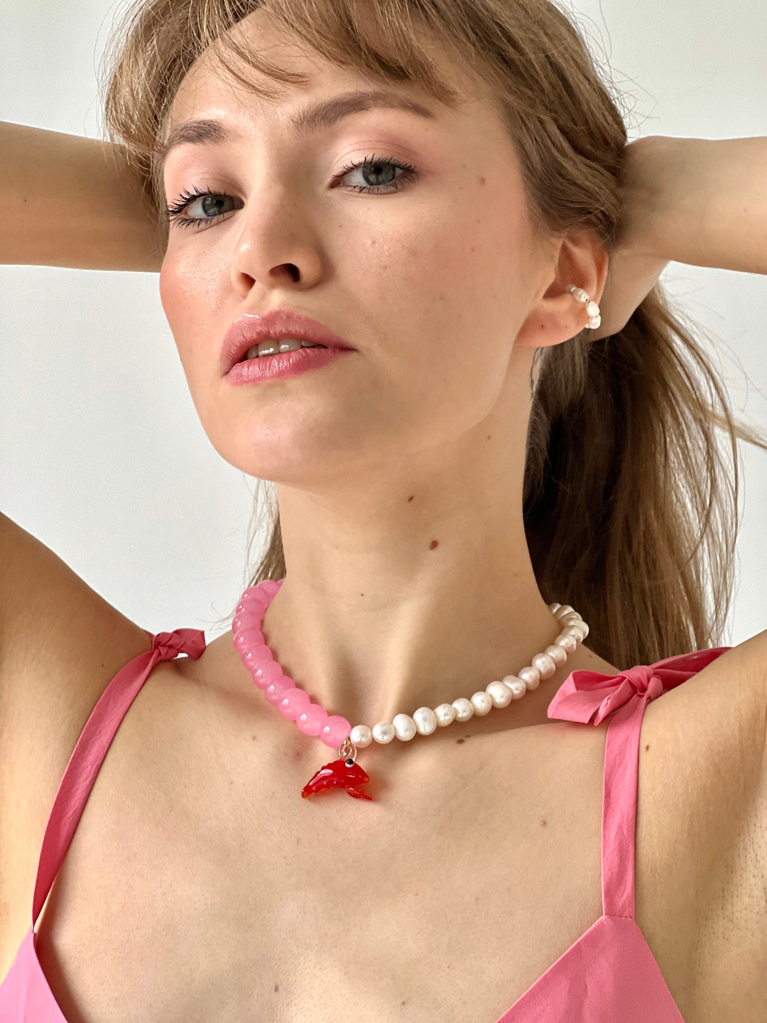 pearls and shrimp charm necklace on model