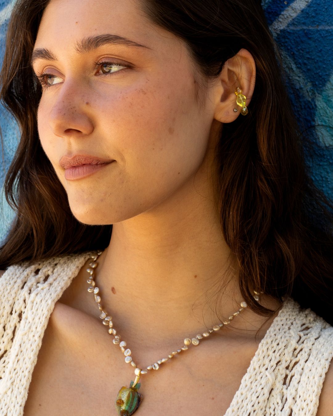 yellow glass beads earcuff on model